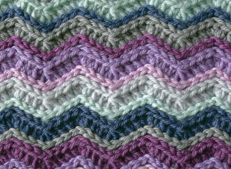 Uniform zig zag crochet pattern in shades of blue, green and purple