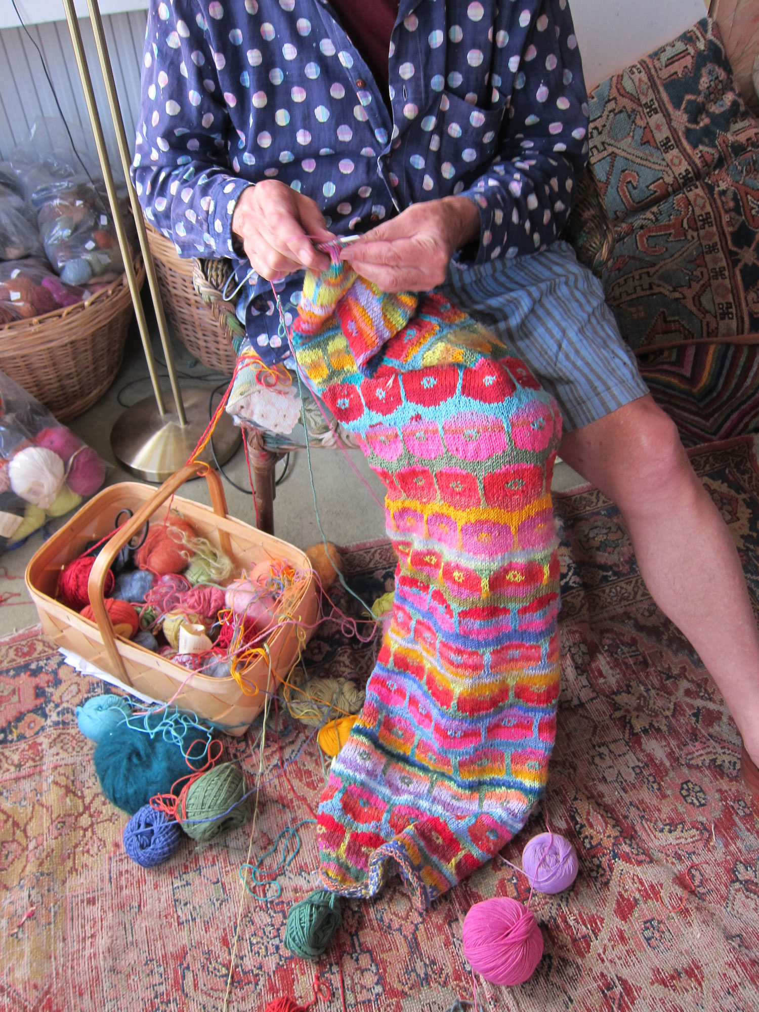 Kaffe Fasset knitting in his workshop