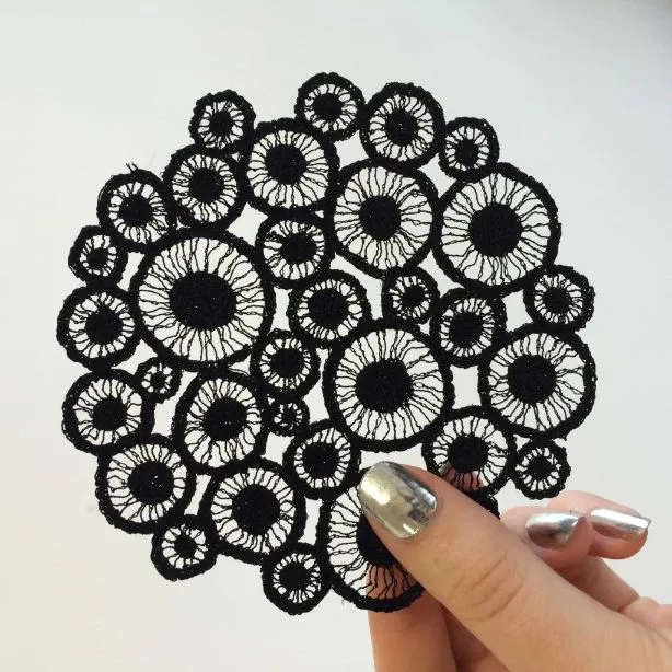 Tiny black piece embroidered by Meredith Woolnough