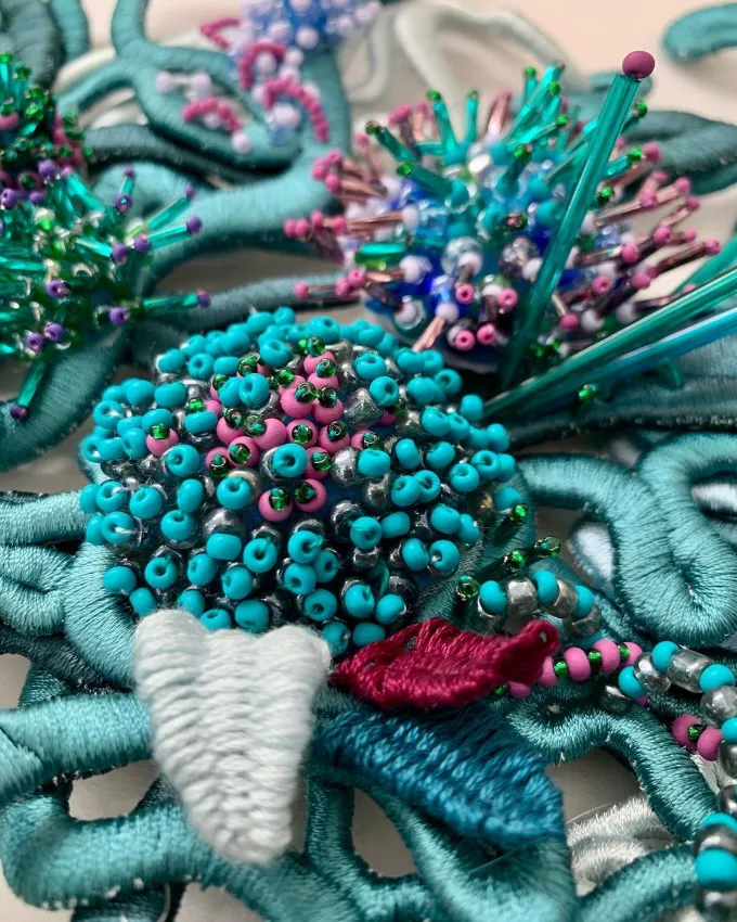 Hand and lock prize winner, Ellen Anderton displays her textile art inspired by the Ocean