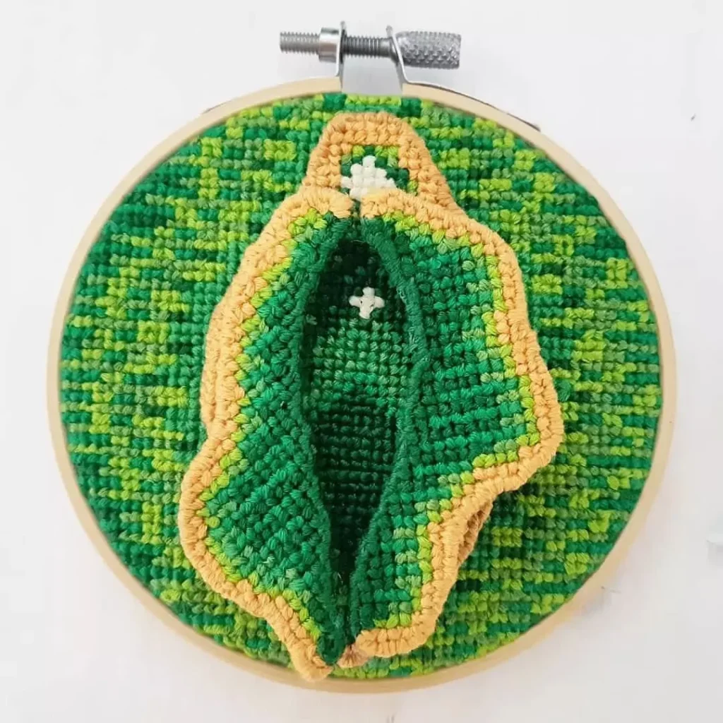 A cross stitched vulva by artist Nicki, aka Utopian Fallopian