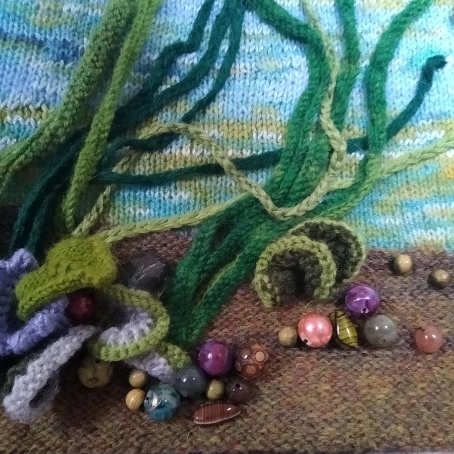Close up detail of ocean inspired knitted bag