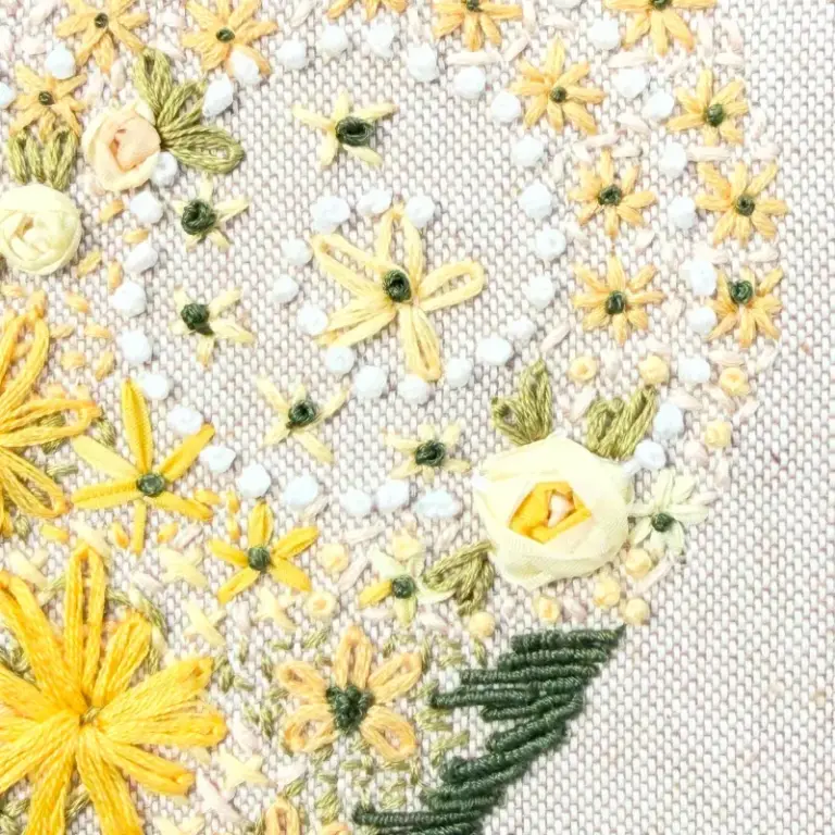 Beautiful hand embroidery showing isolated stitch in a heart design by one of our hand embroidery students