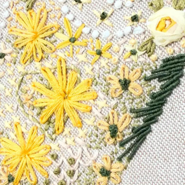 Beautiful hand embroidery showing isolated stitch in a heart design by one of our hand embroidery students