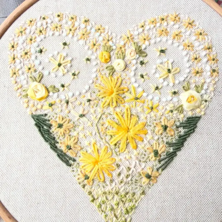 Beautiful hand embroidery showing isolated stitch in a heart design by one of our hand embroidery students