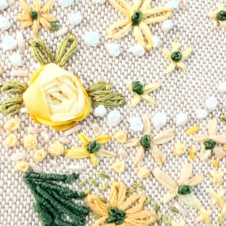 Beautiful hand embroidery showing isolated stitch in a heart design by one of our hand embroidery students