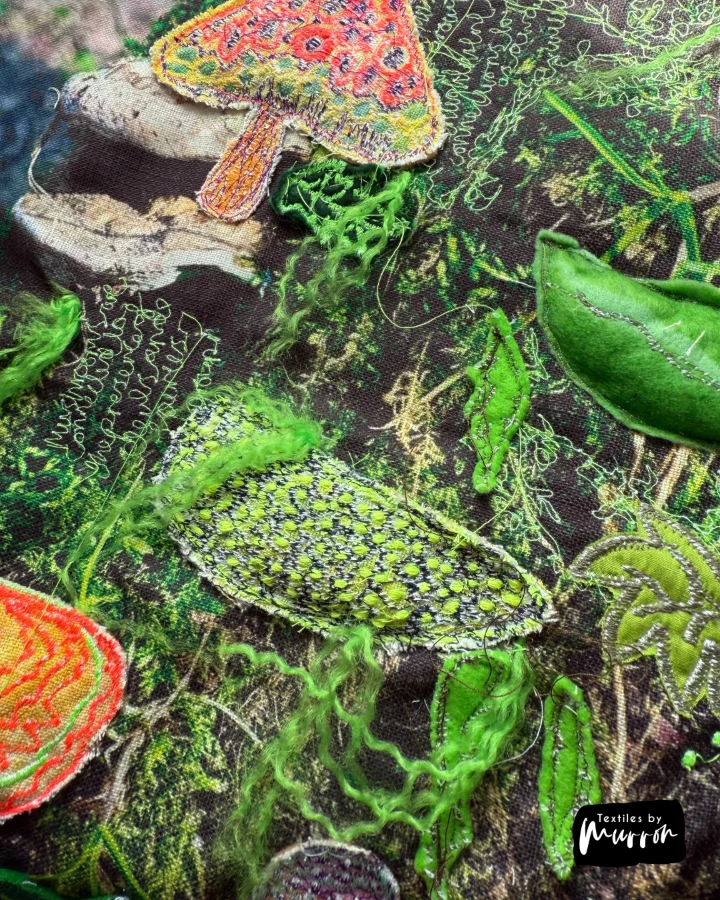 Mixed media textile artwork by Murron Fraser from the Hidden Worlds series, machine embroidery and UV-reactive threads on layered fabric.