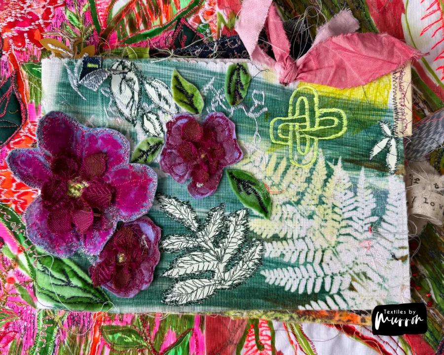 Detail of a mixed media textile artwork by Murron Fraser, printmaking and machine embroidery on layered fabric.