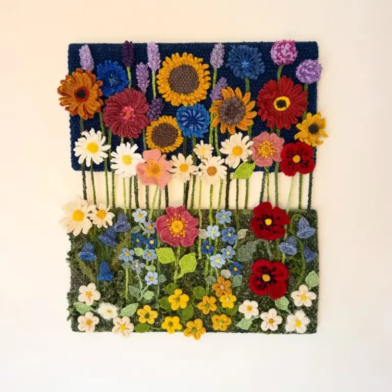 Beautiful knitted flower composition by Cilla, one of our advanced knitting students who is studying skill stage 4
