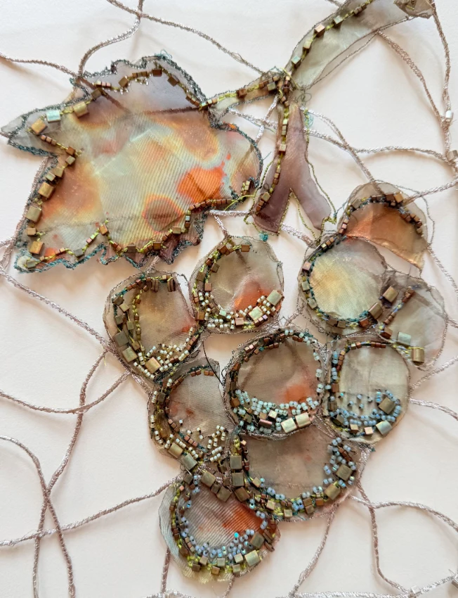 Organic beaded textile cluster in mixed media with wire and layered fabric, by SST graduate Cheryl McNay